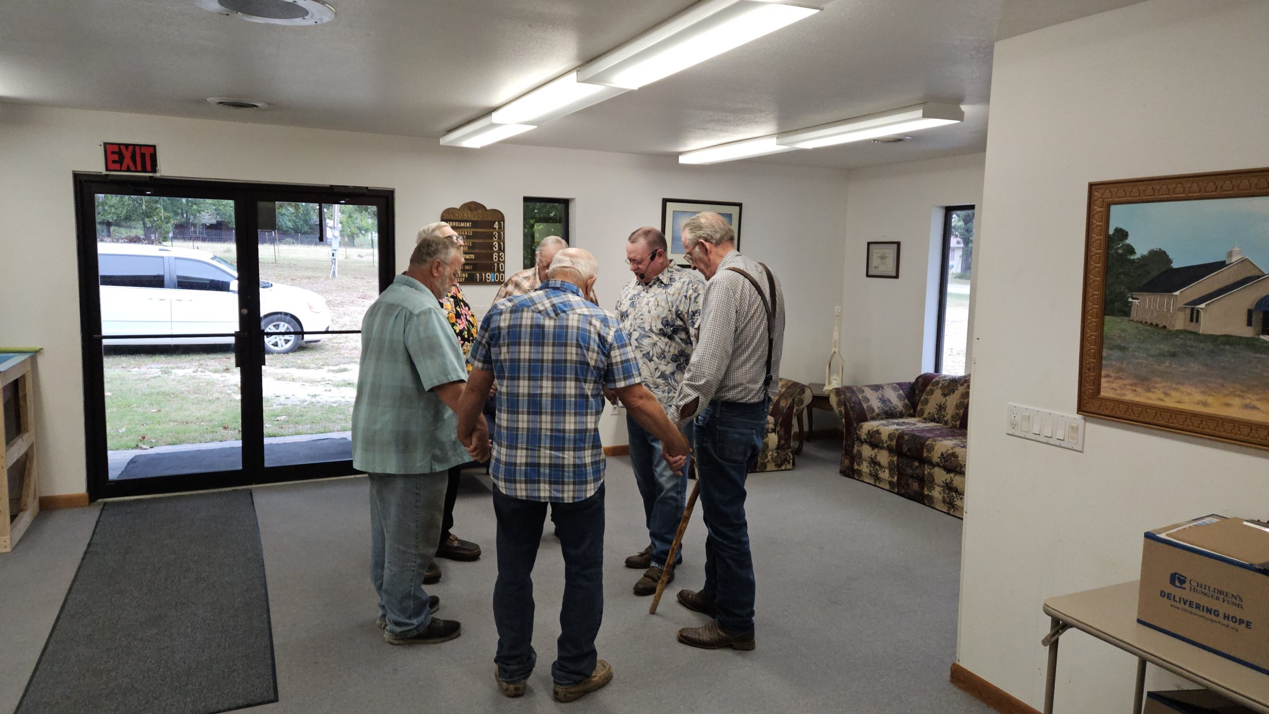 Church leadership in church narthex praying