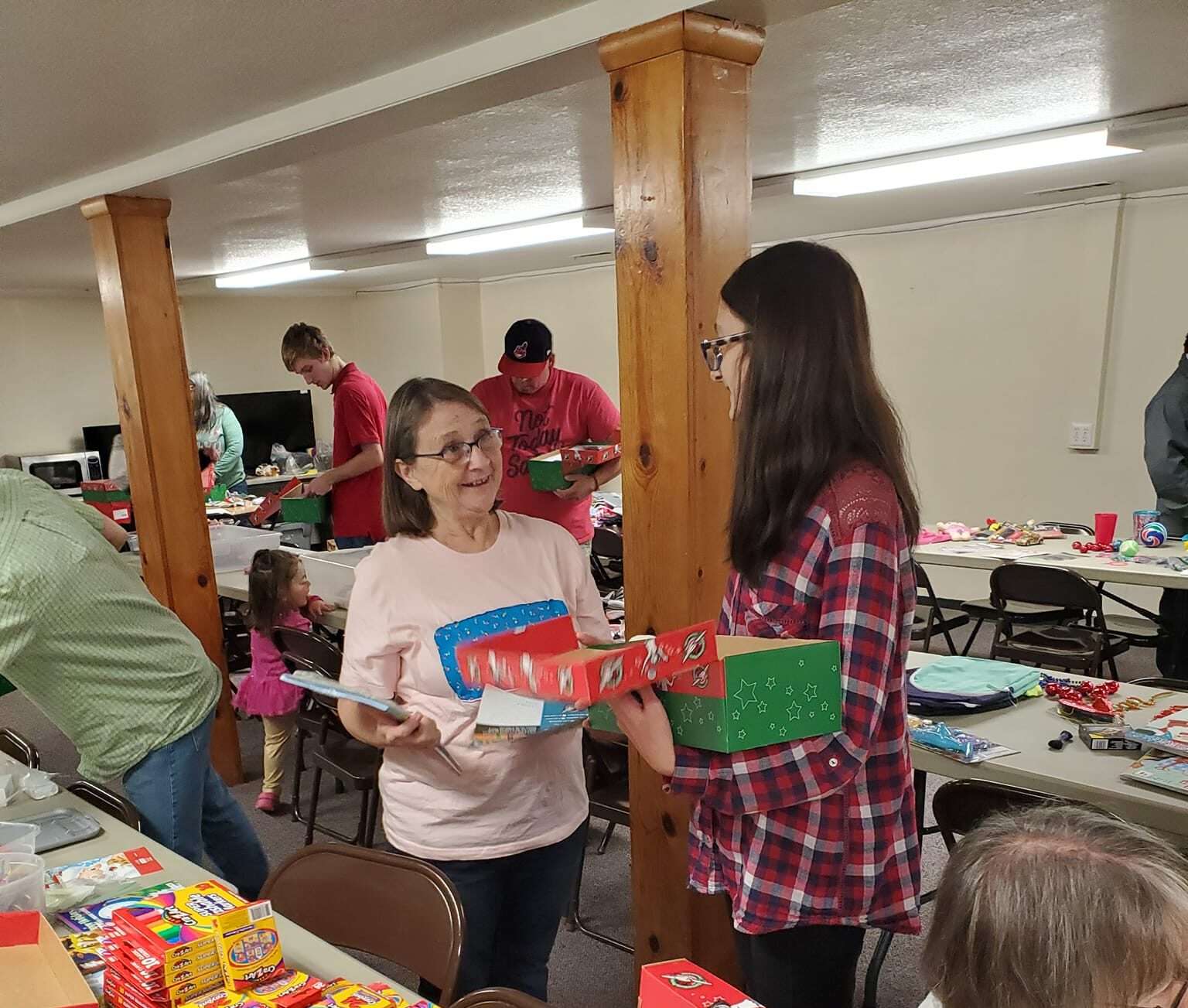 Church volunteers filling Operation Christmas Child shoe boxes